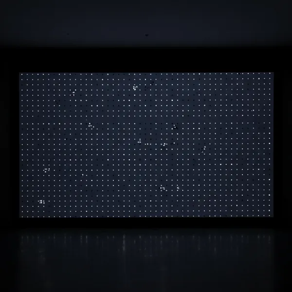 A projector screen displaying a "starry night" effect with scattered white and black dots.