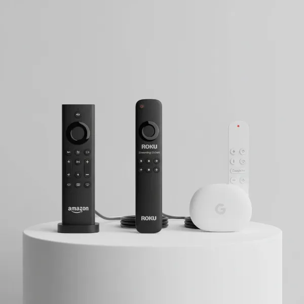 A lineup of different streaming devices like Amazon Fire TV Stick, Roku, and Google Chromecast, illustrating choices